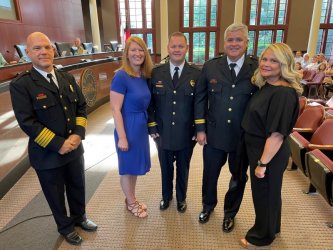 DFD Chief Todd Pangle (left), Training Chief Dempsey (with wife Traci Dempsey) and Training Chief Daniel (with wife Sherri)